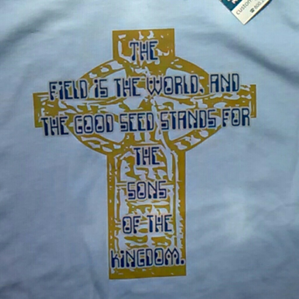 New sky blue T-shirt, 100% cotton, with gold/navy blue cross.